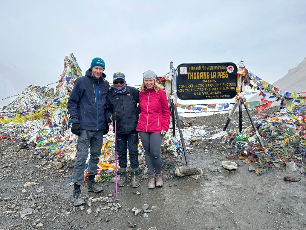 RM Treks' Clients with our guide Uttar at Thorong La Pass - Classic Annapurna Circuit Trek